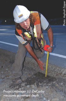 Project Manager J.J. DeCorby measures pavement depth